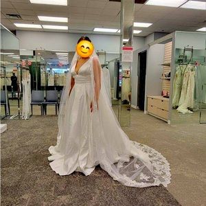 Size 14 David’s Bridal wedding dress. NEVER WORN!